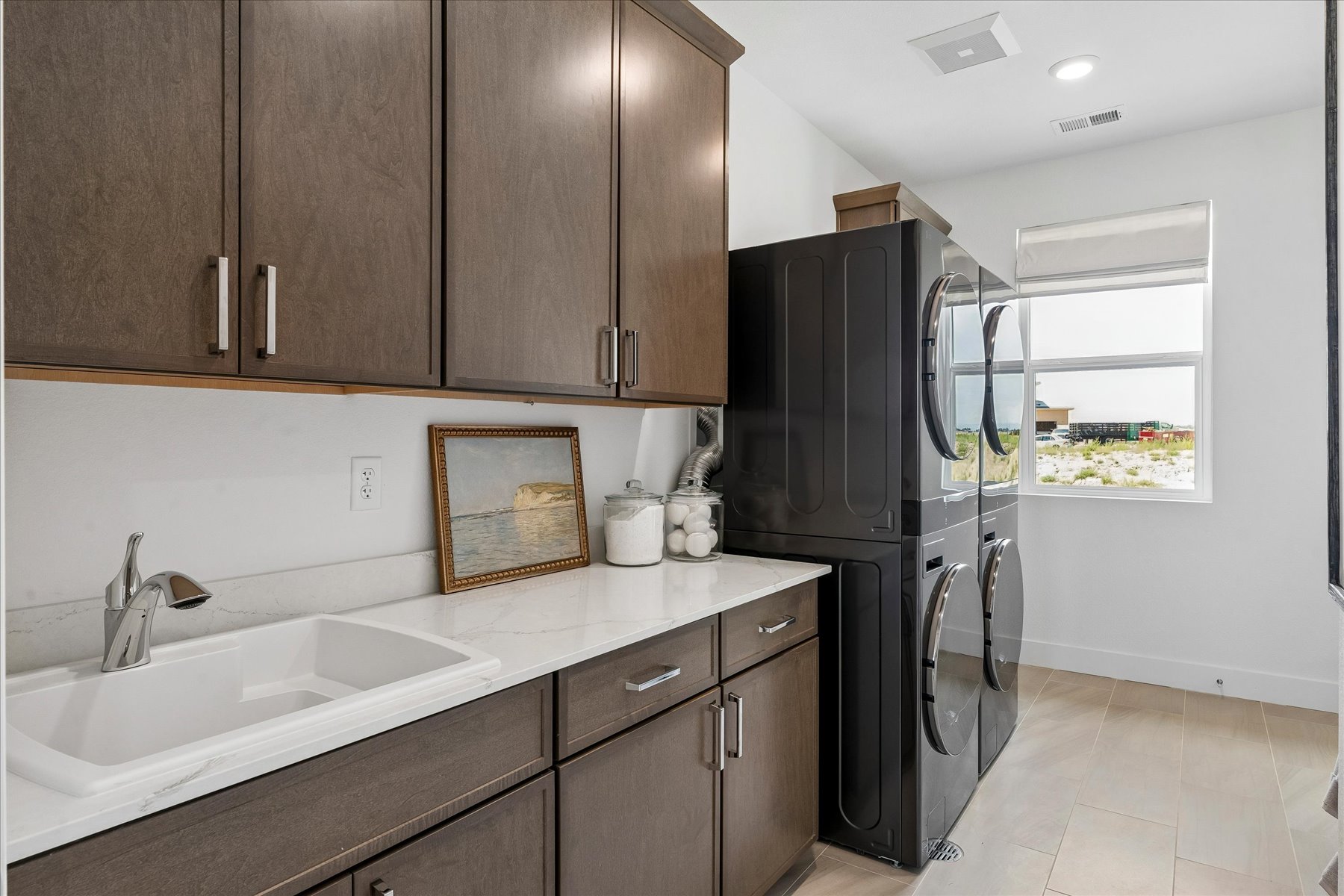 A kitchen with wooden cabinets.