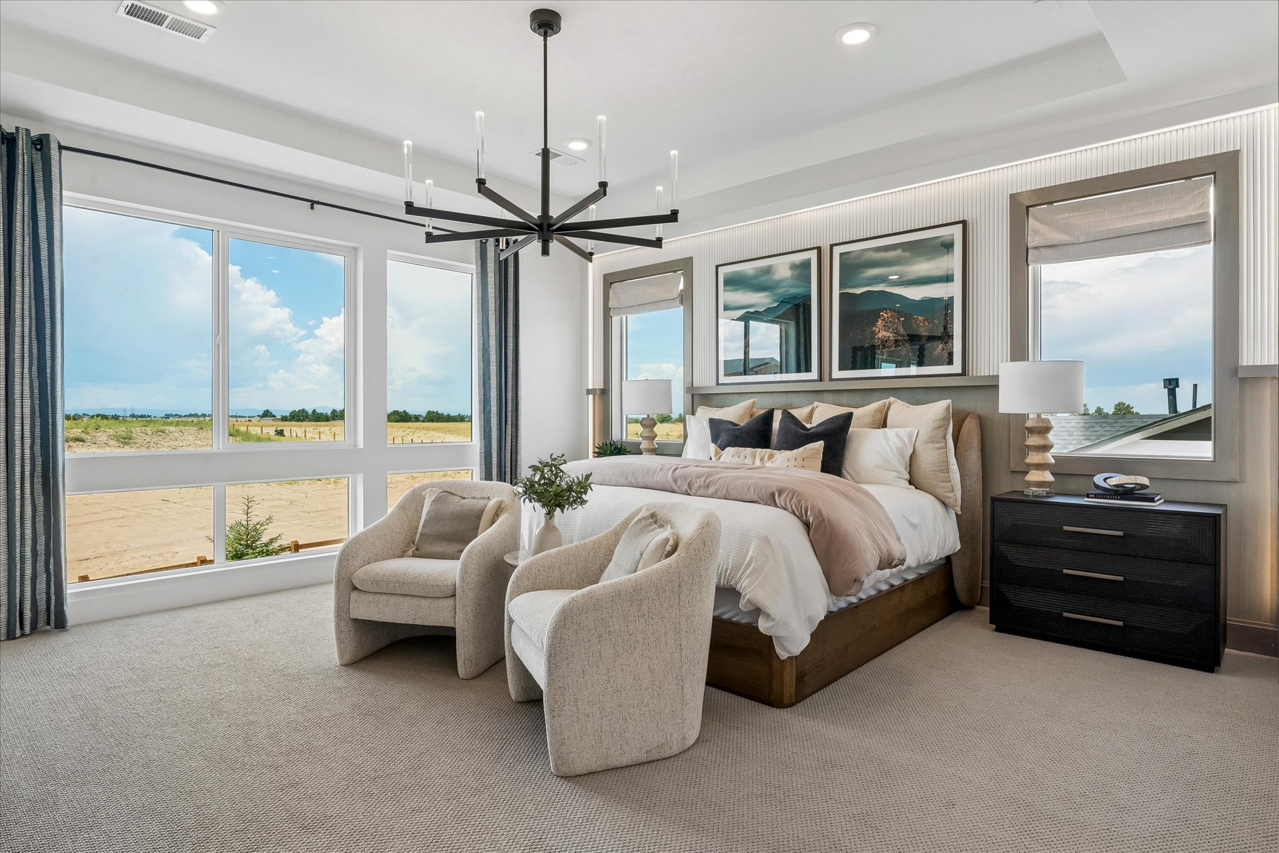 A bedroom with a large window.
