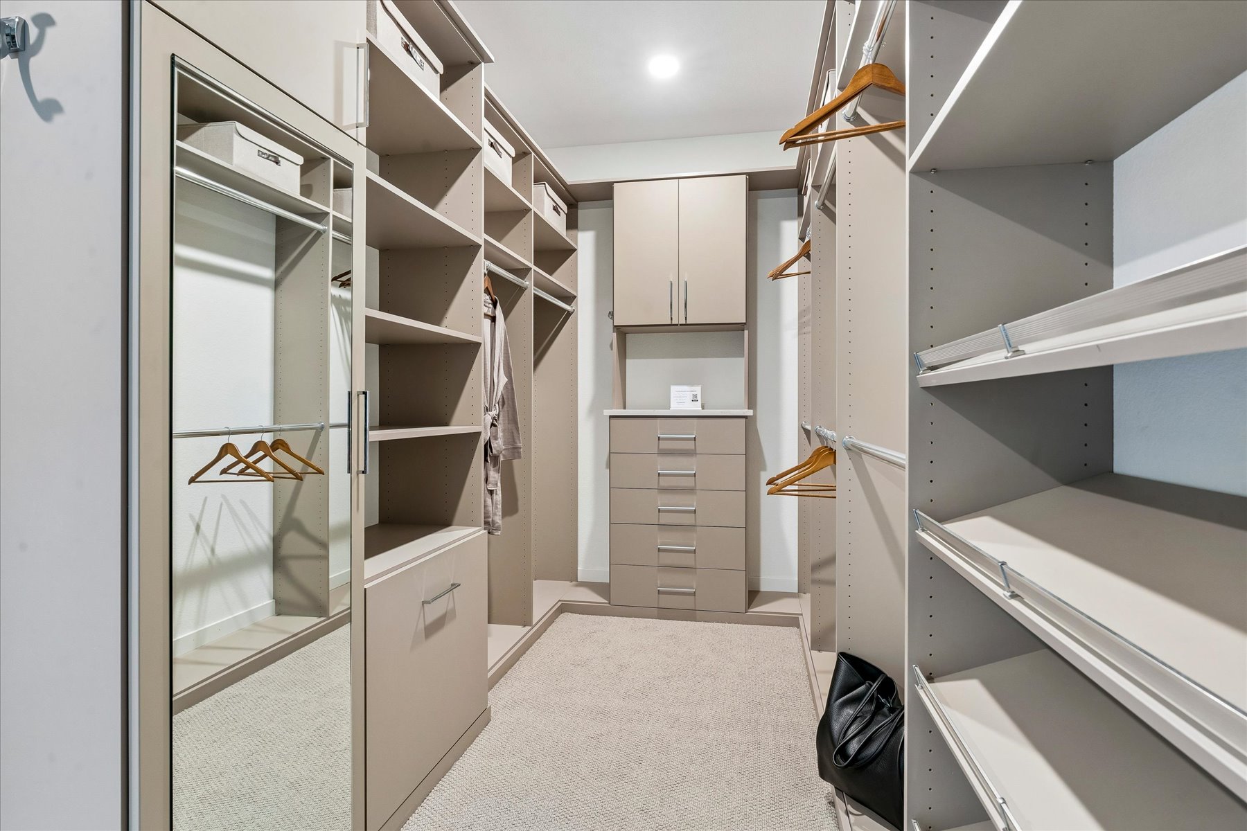 A room with shelves and a door.