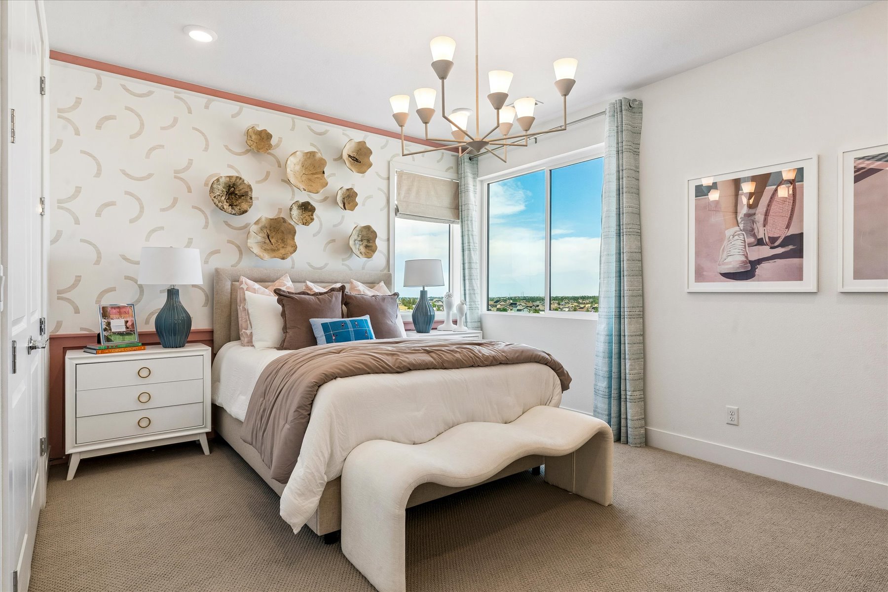 A bedroom with a bed and a lamp.