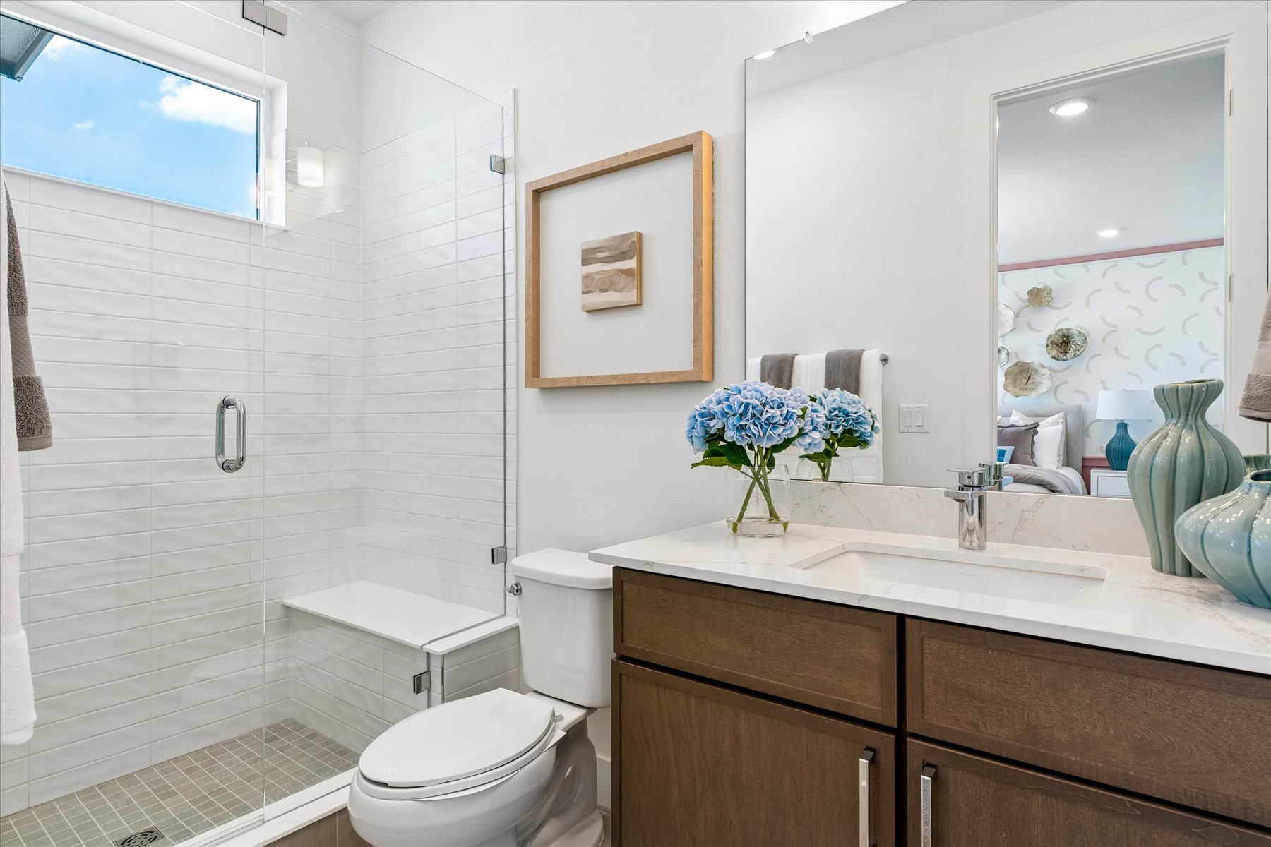 A bathroom with a glass shower.