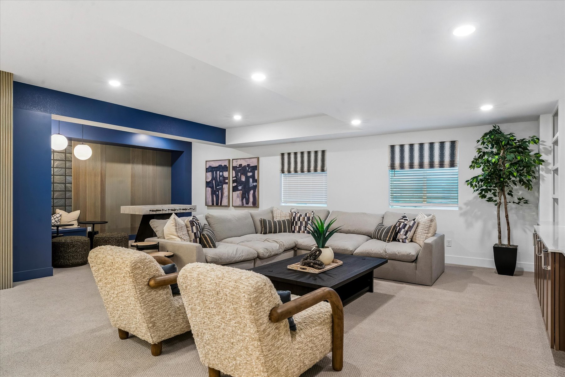 A living room with a couch and chairs.