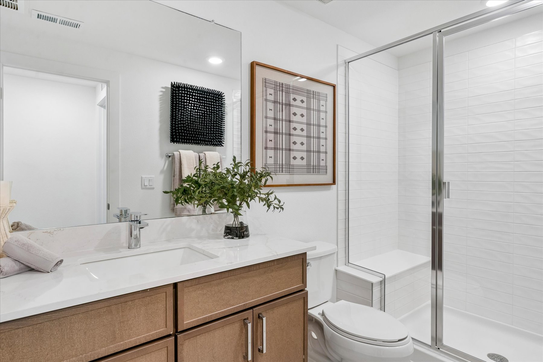 A bathroom with a glass shower.