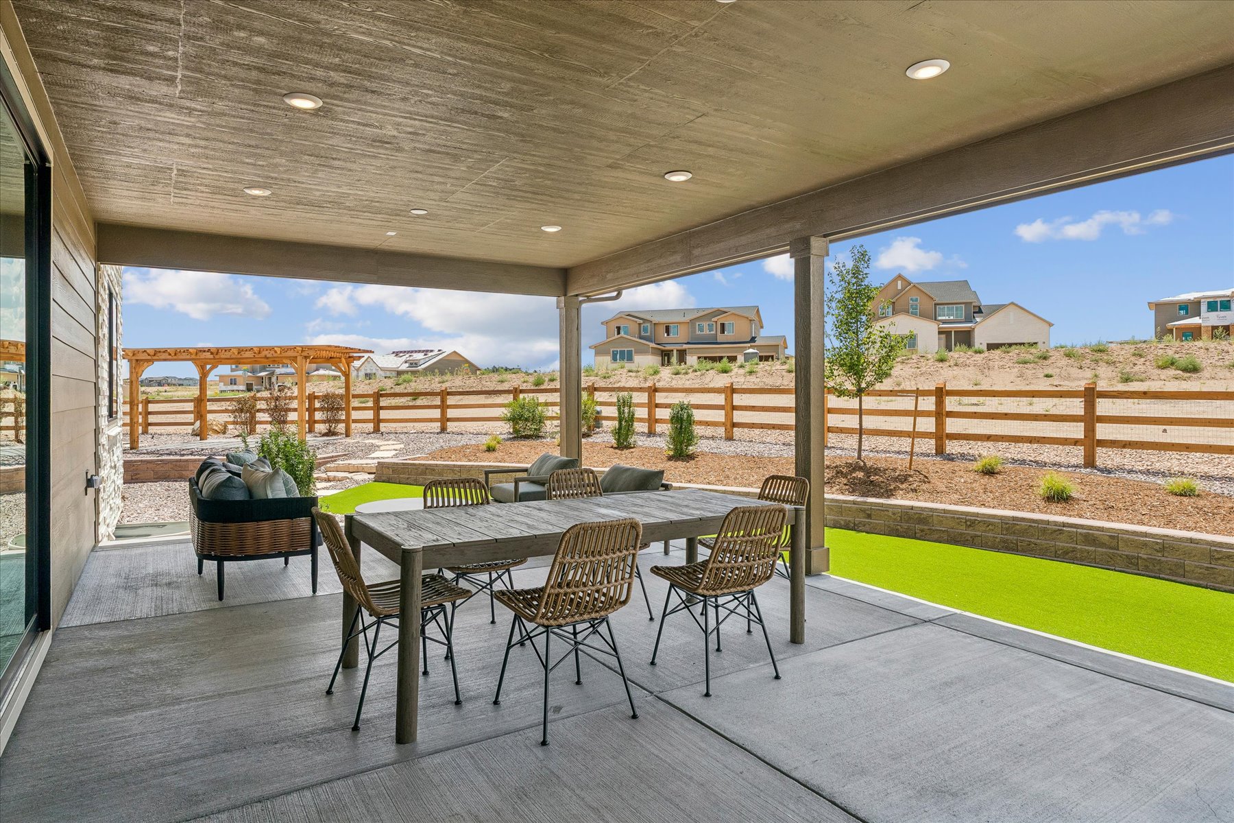 A patio with a table and chairs.