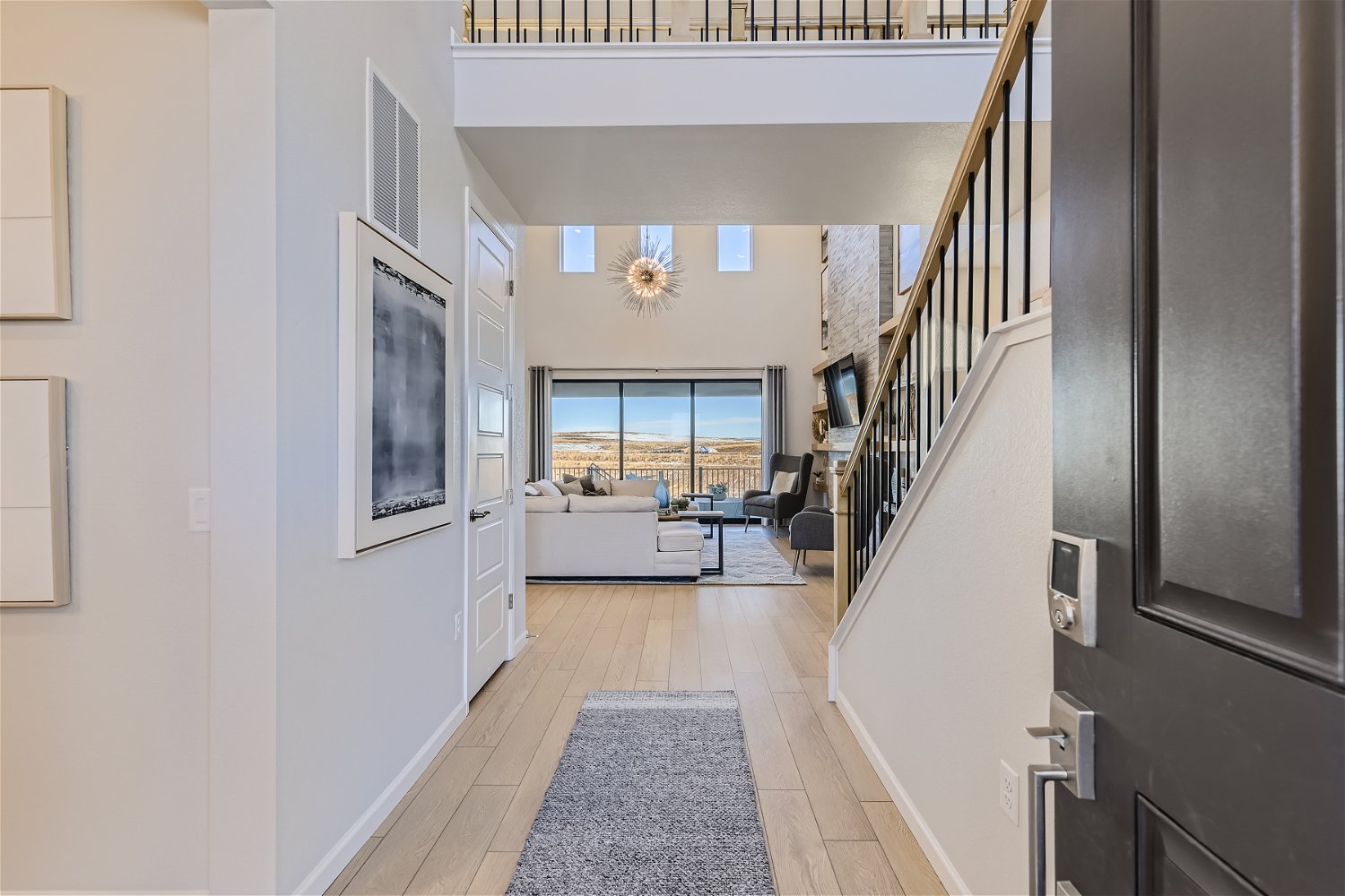 A room with a staircase and a table.