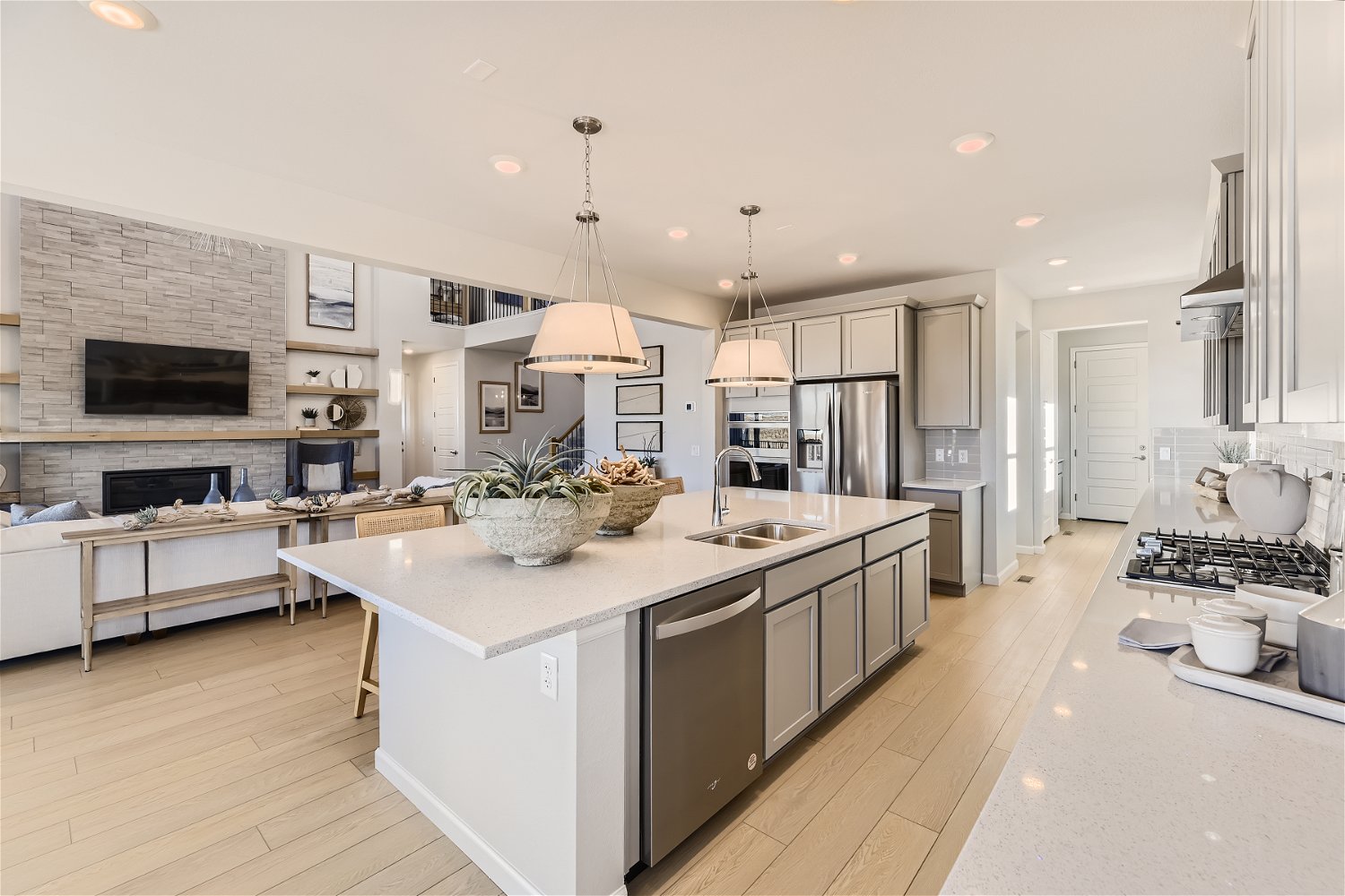 A kitchen with a marble island.