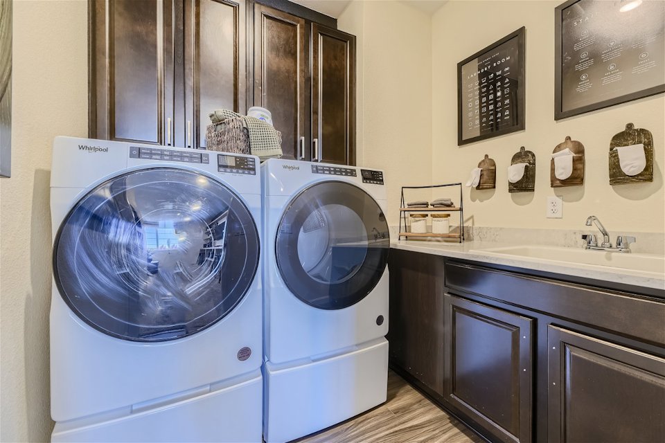 A washer and dryer in a room.
