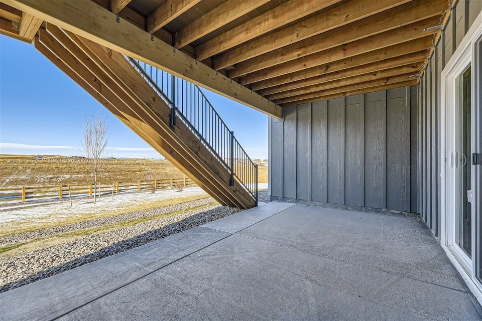 A concrete walkway with a metal frame.