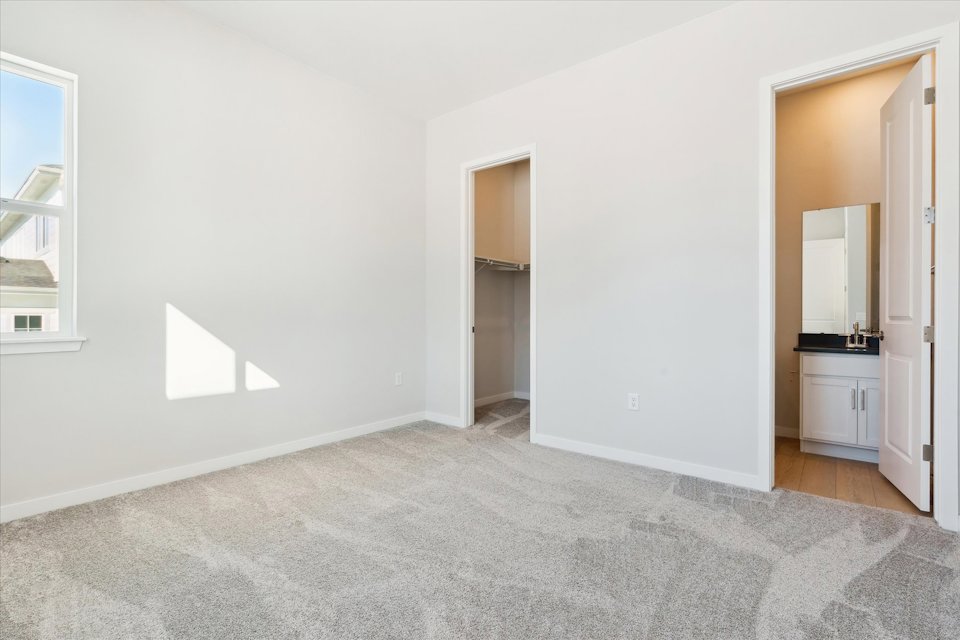 A hallway with white walls.