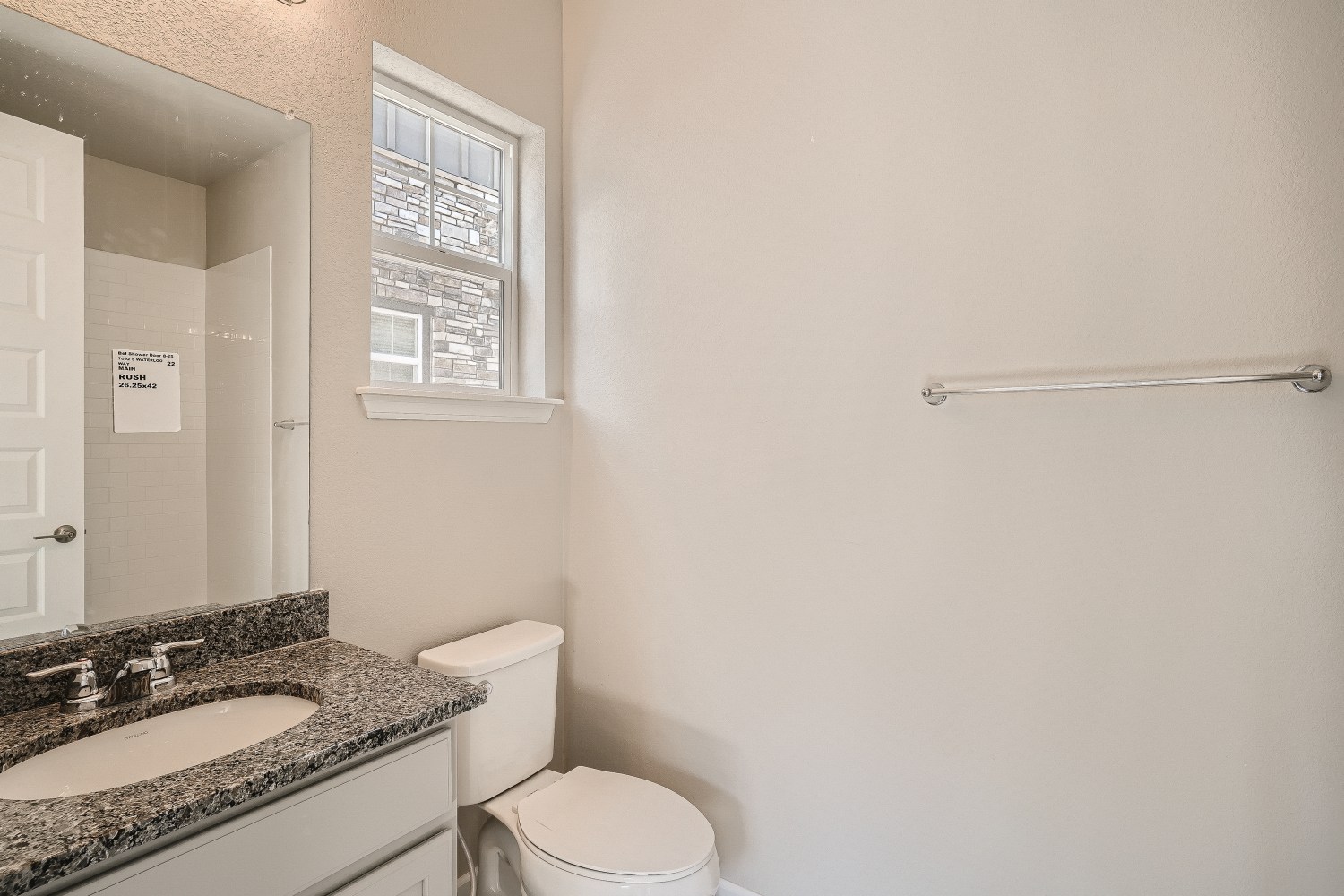 A bathroom with a sink and toilet.