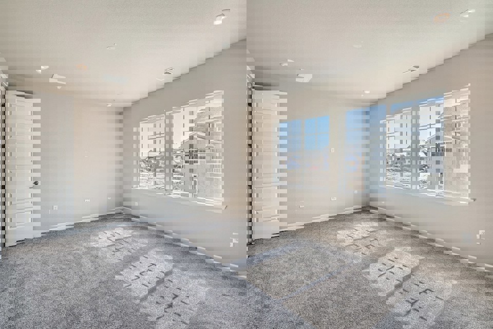 A room with a tile floor and windows.