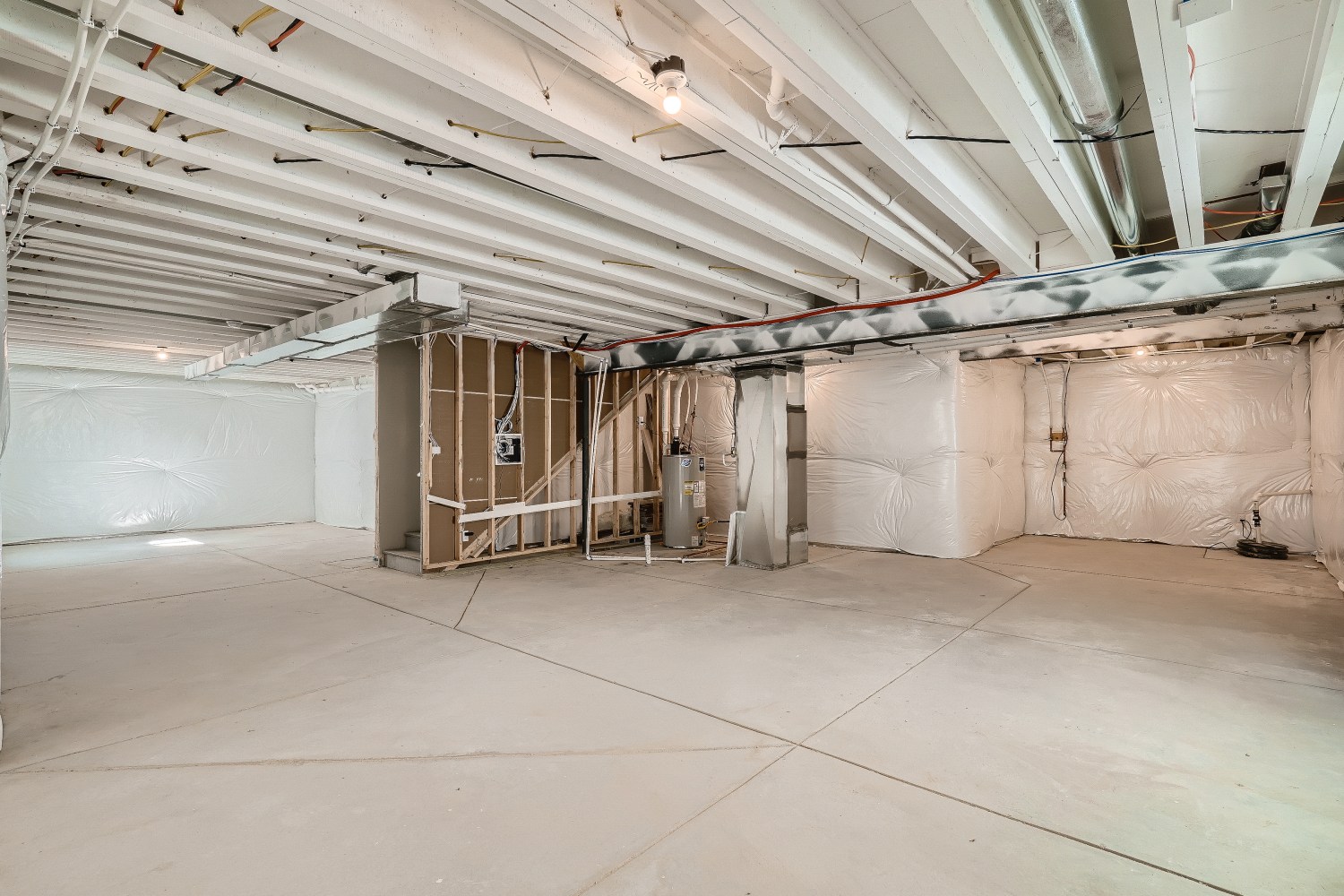 A large room with a few boxes.