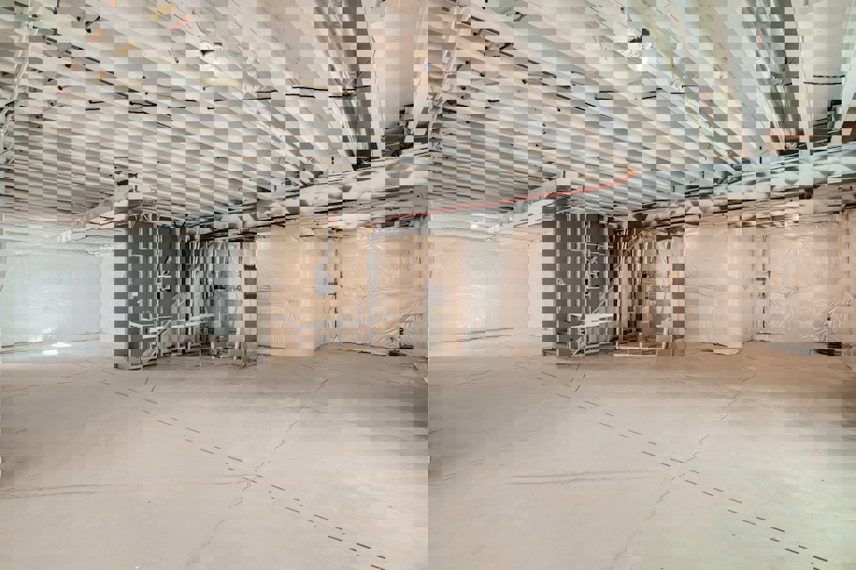 A large room with a few boxes.