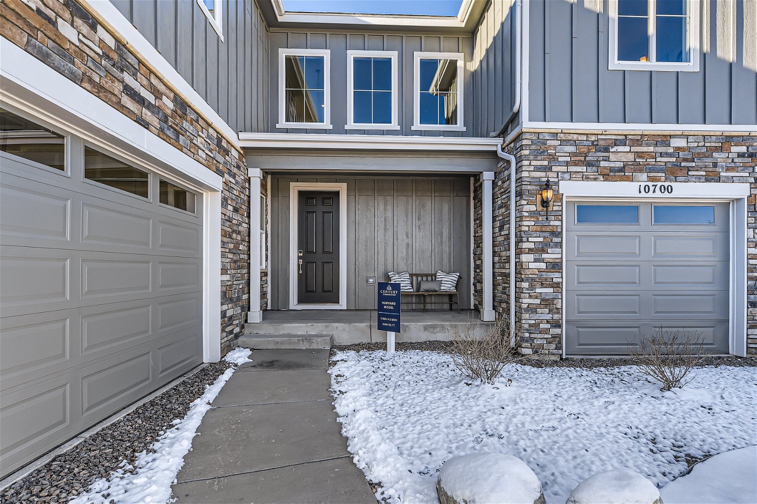 A building with garages and snow.