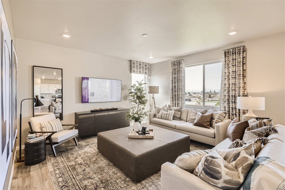 A living room with a tv and couches.
