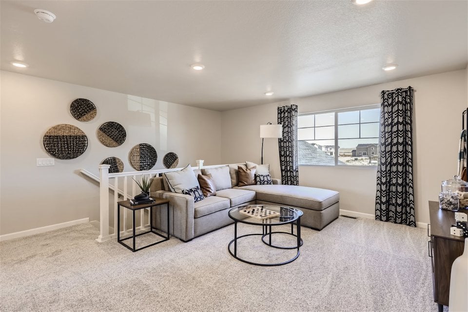 A living room with a couch and a coffee table.