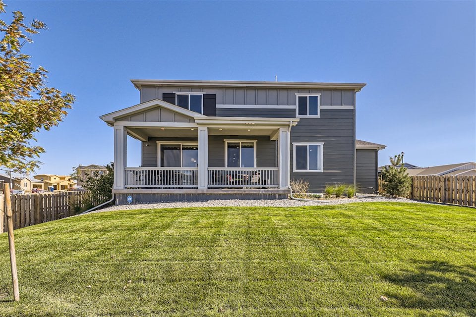 A house with a lawn in front of it.