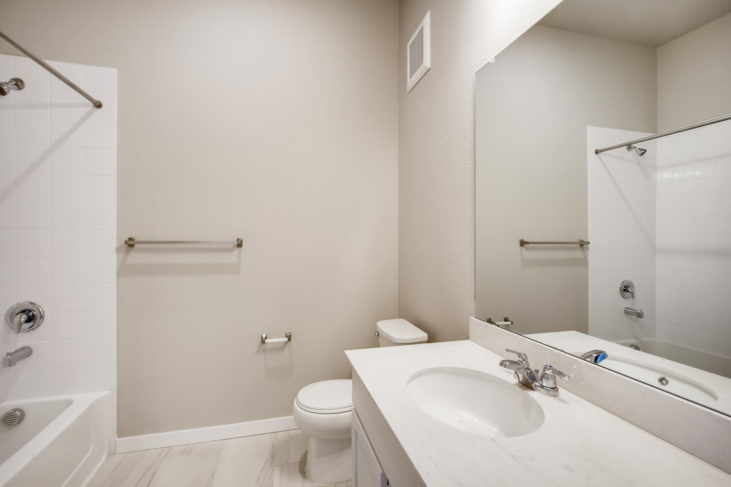 A bathroom with a standup shower.