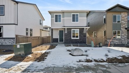 A group of houses with snow on the ground.