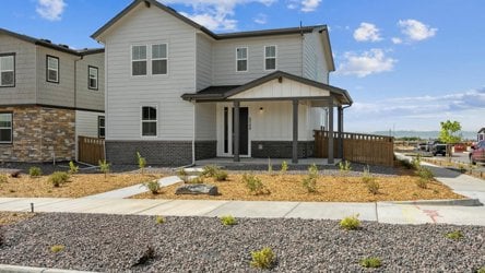 A house with a fence and a driveway.