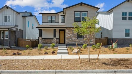 A house with a tree in the front.