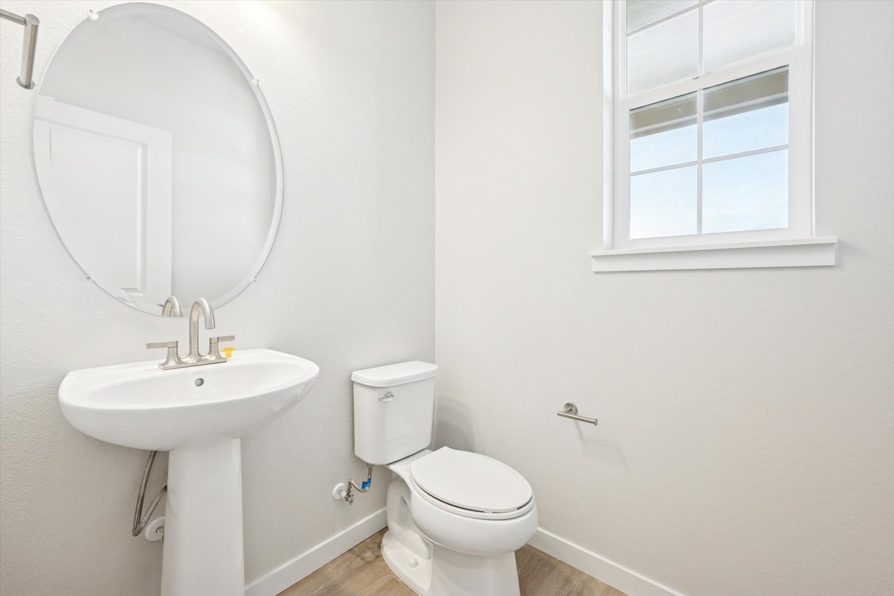 A bathroom with a sink and toilet.