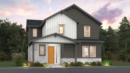 A house with trees in the back.