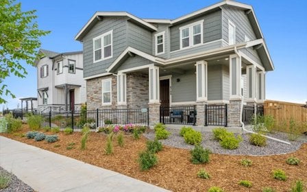A house with a fence and a driveway.