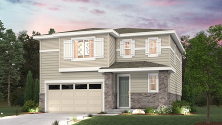 A house with a garage and trees.