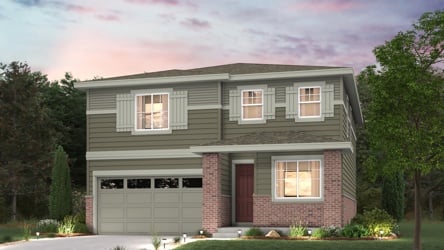 A house with a garage and trees.