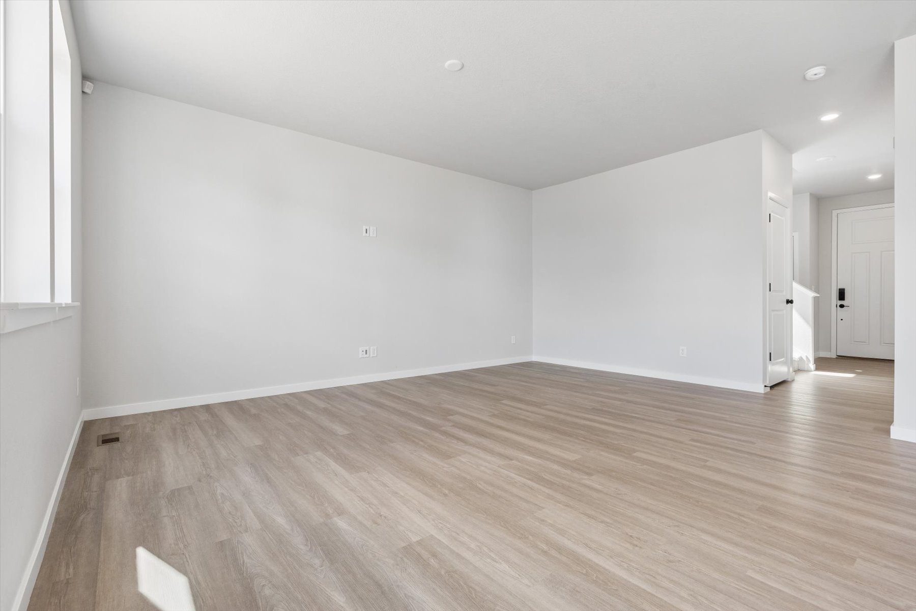 A room with a wood floor.