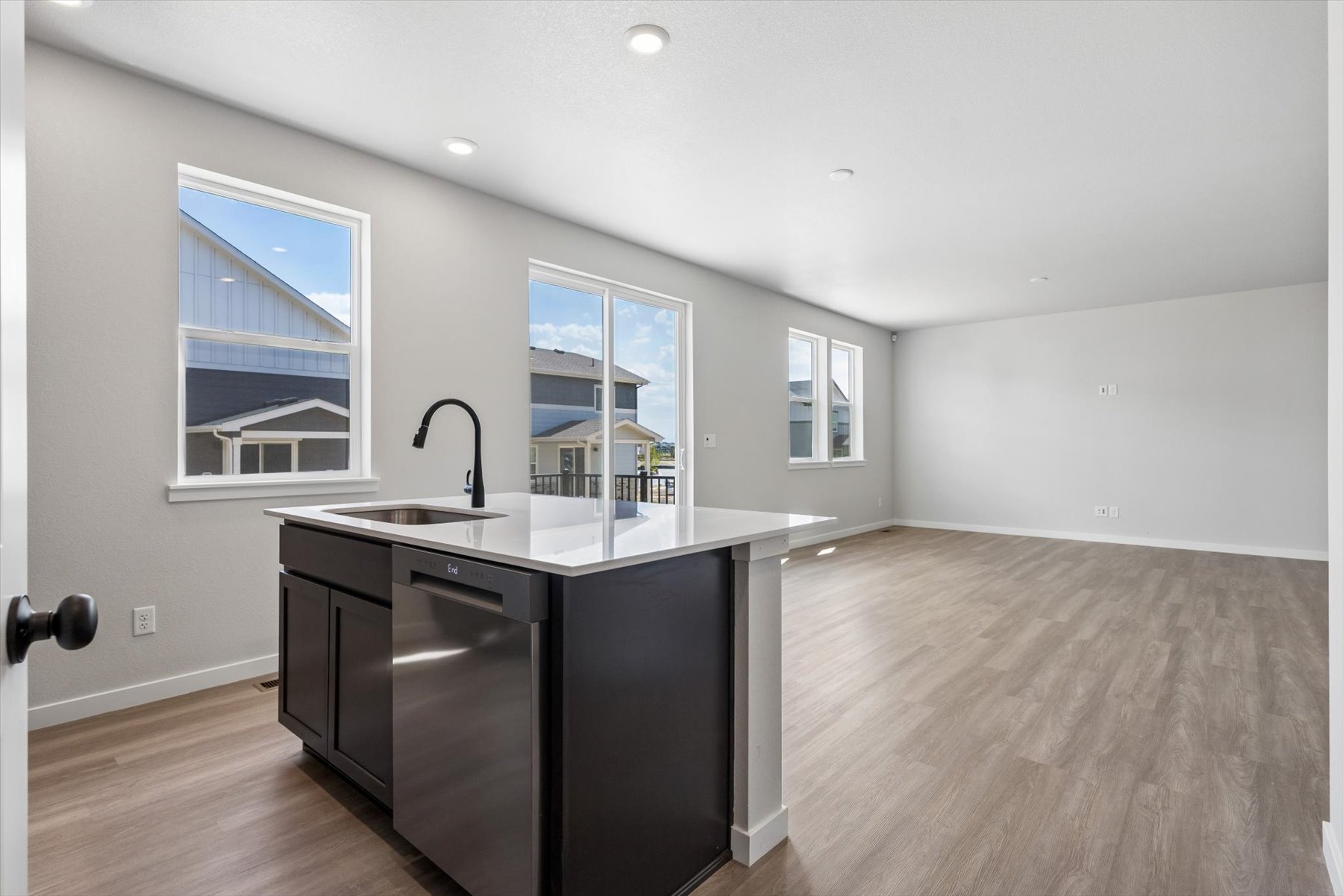 A kitchen with a sink and cabinets.