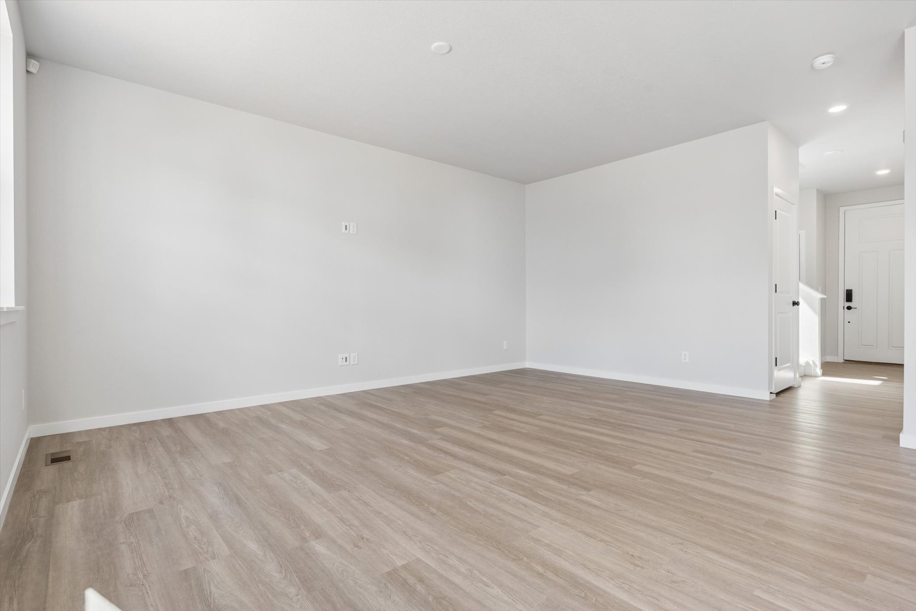 A room with wood floors.