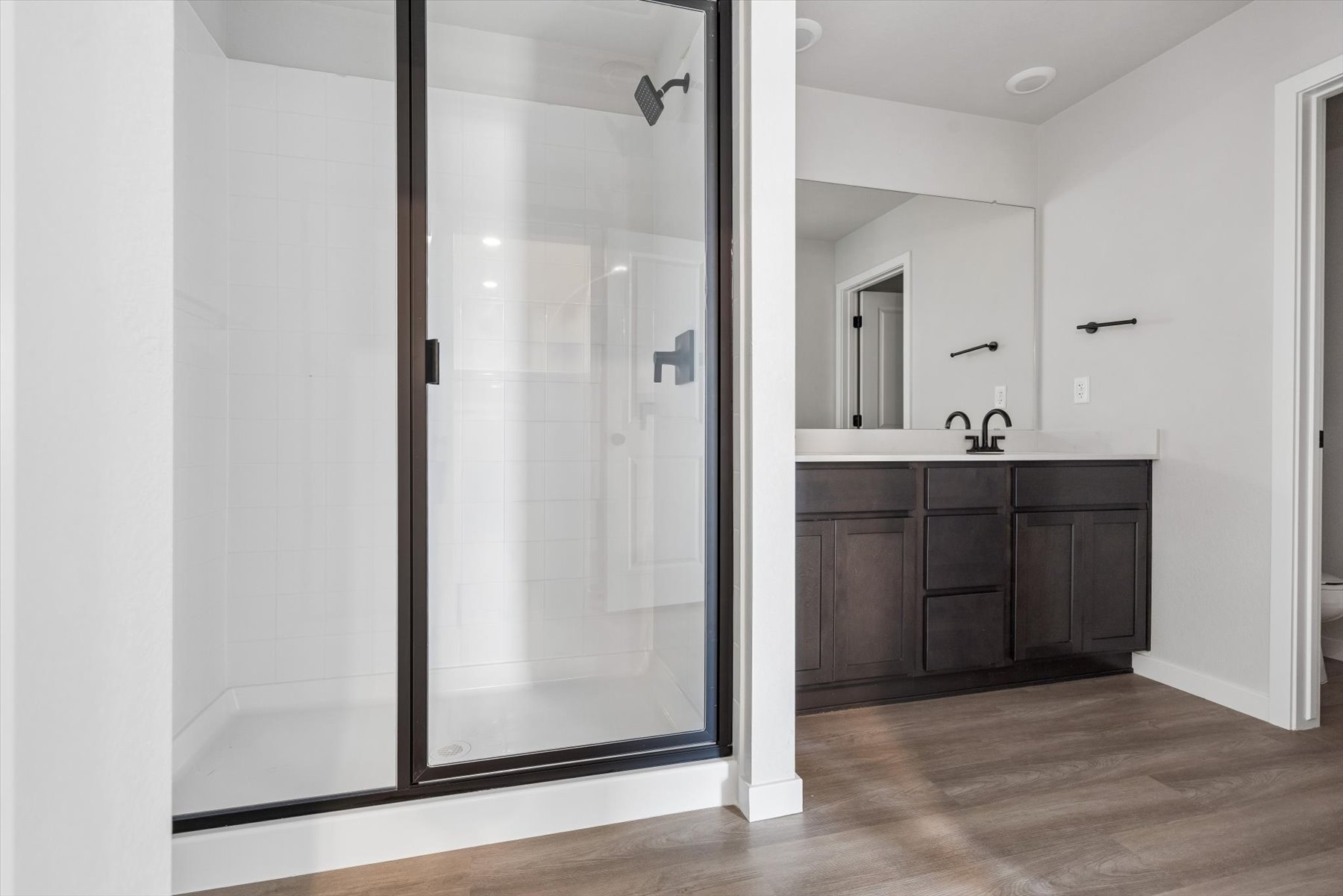A bathroom with a glass shower.