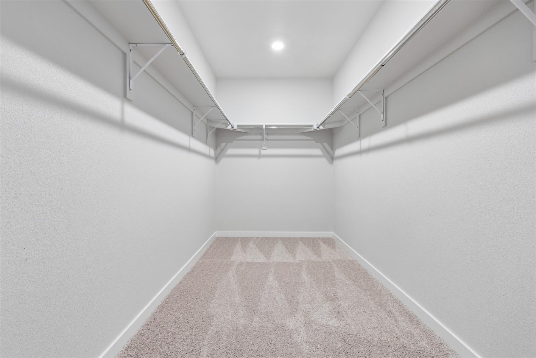 A hallway with white walls.
