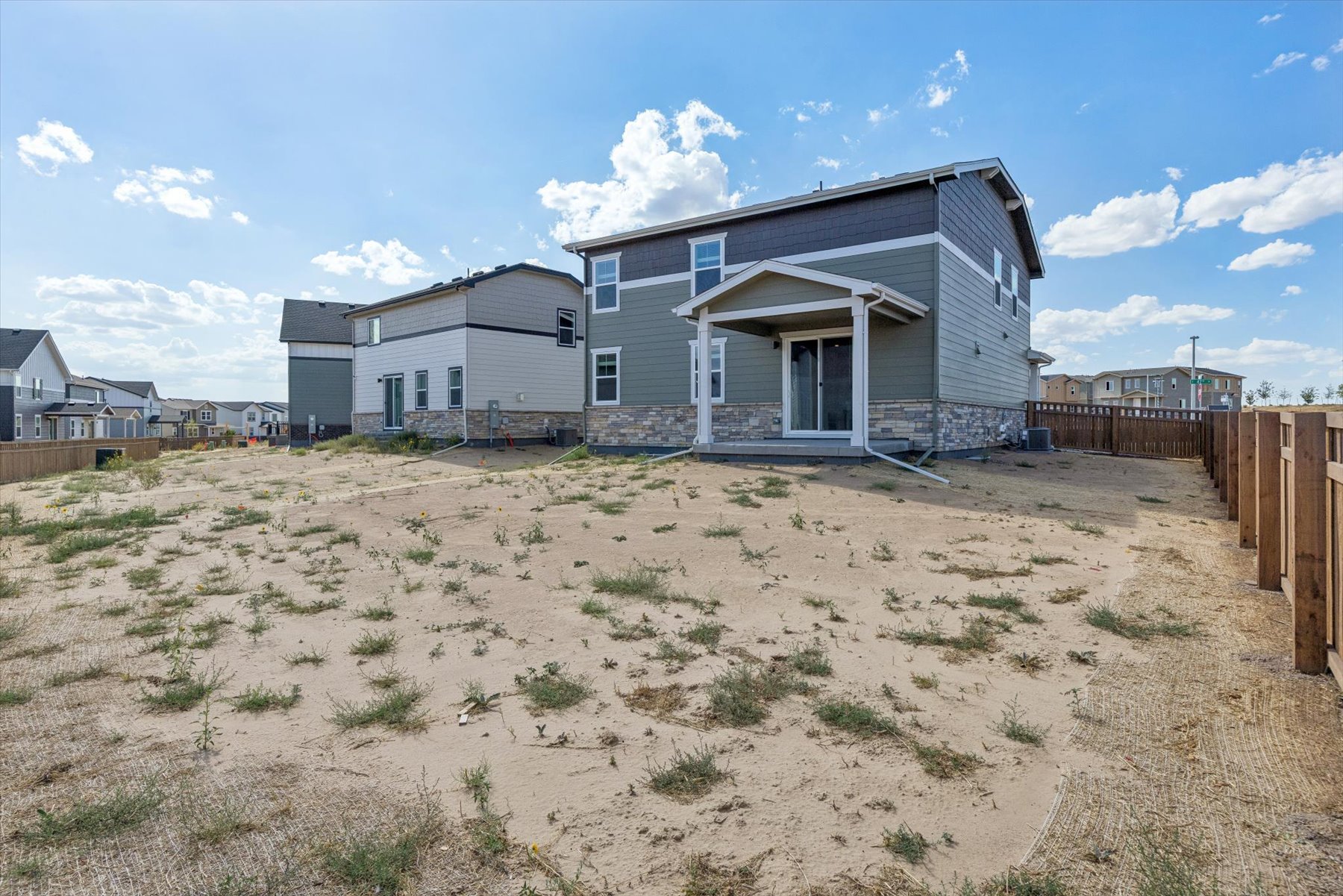 A house in a dirt field.