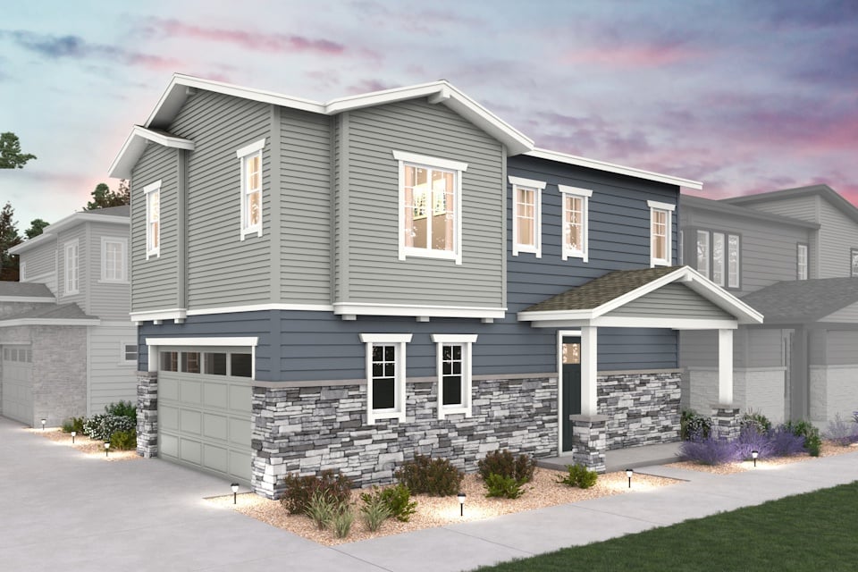 A grey house with a driveway.