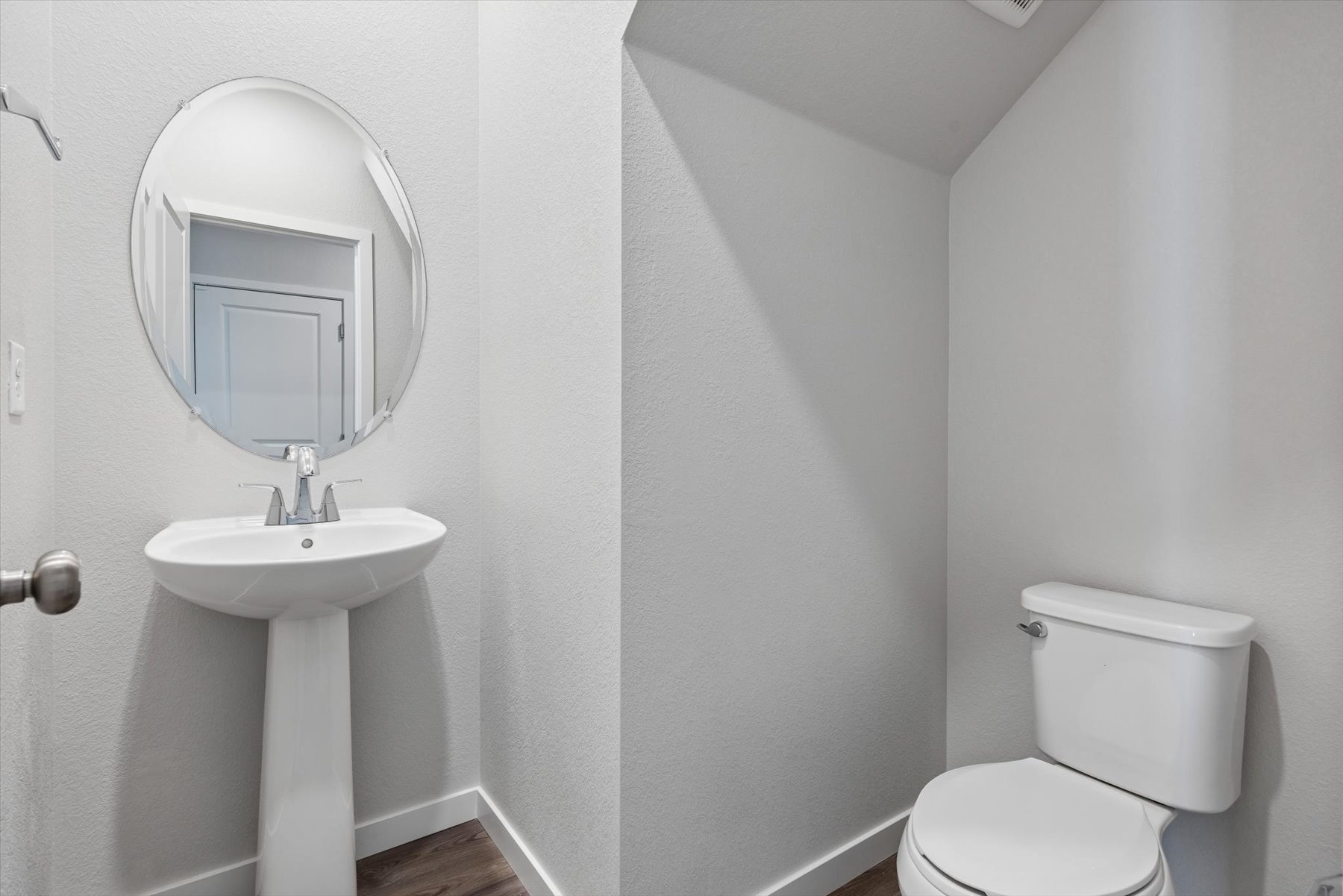 A bathroom with a sink and toilet.