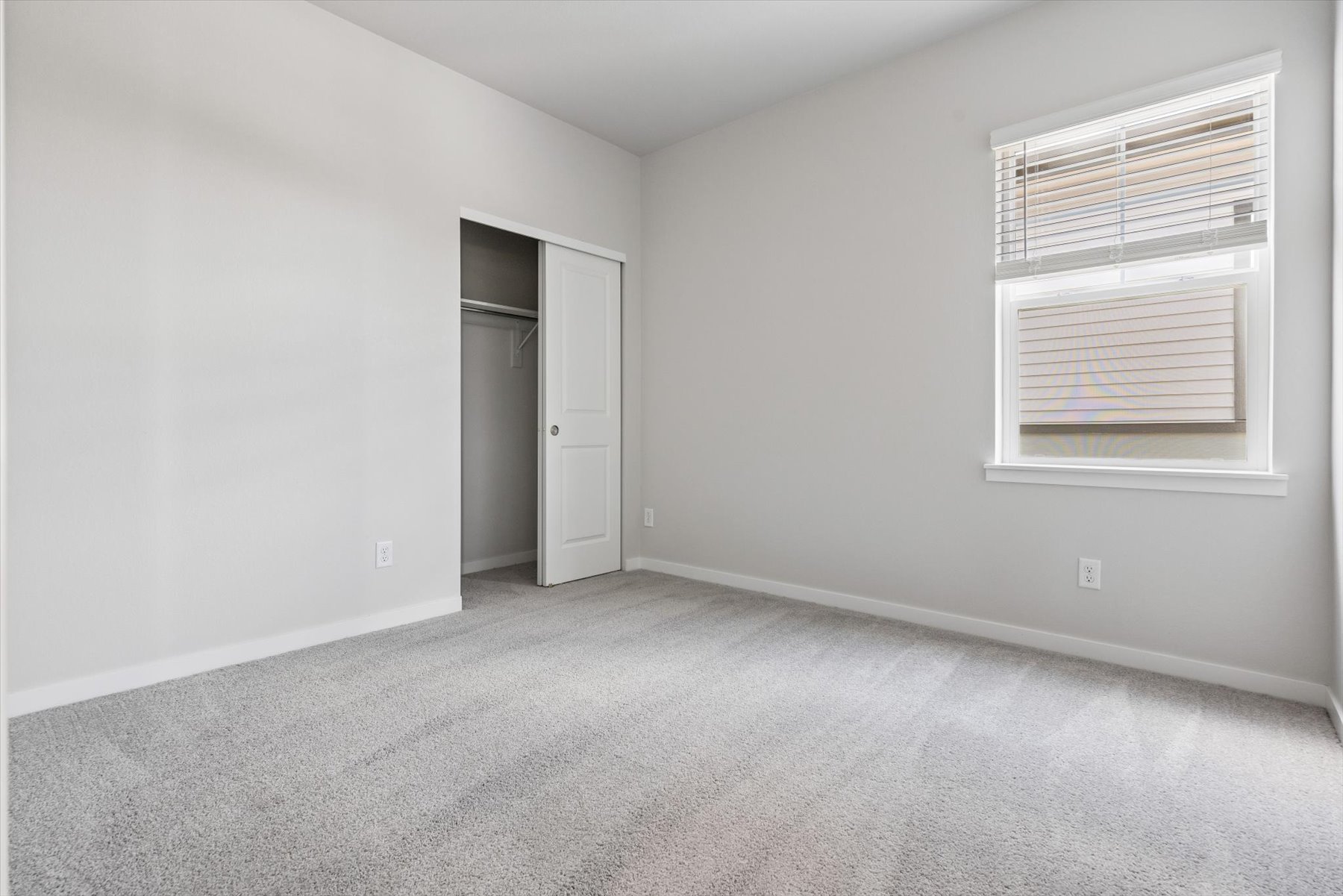 A room with a door and a window.
