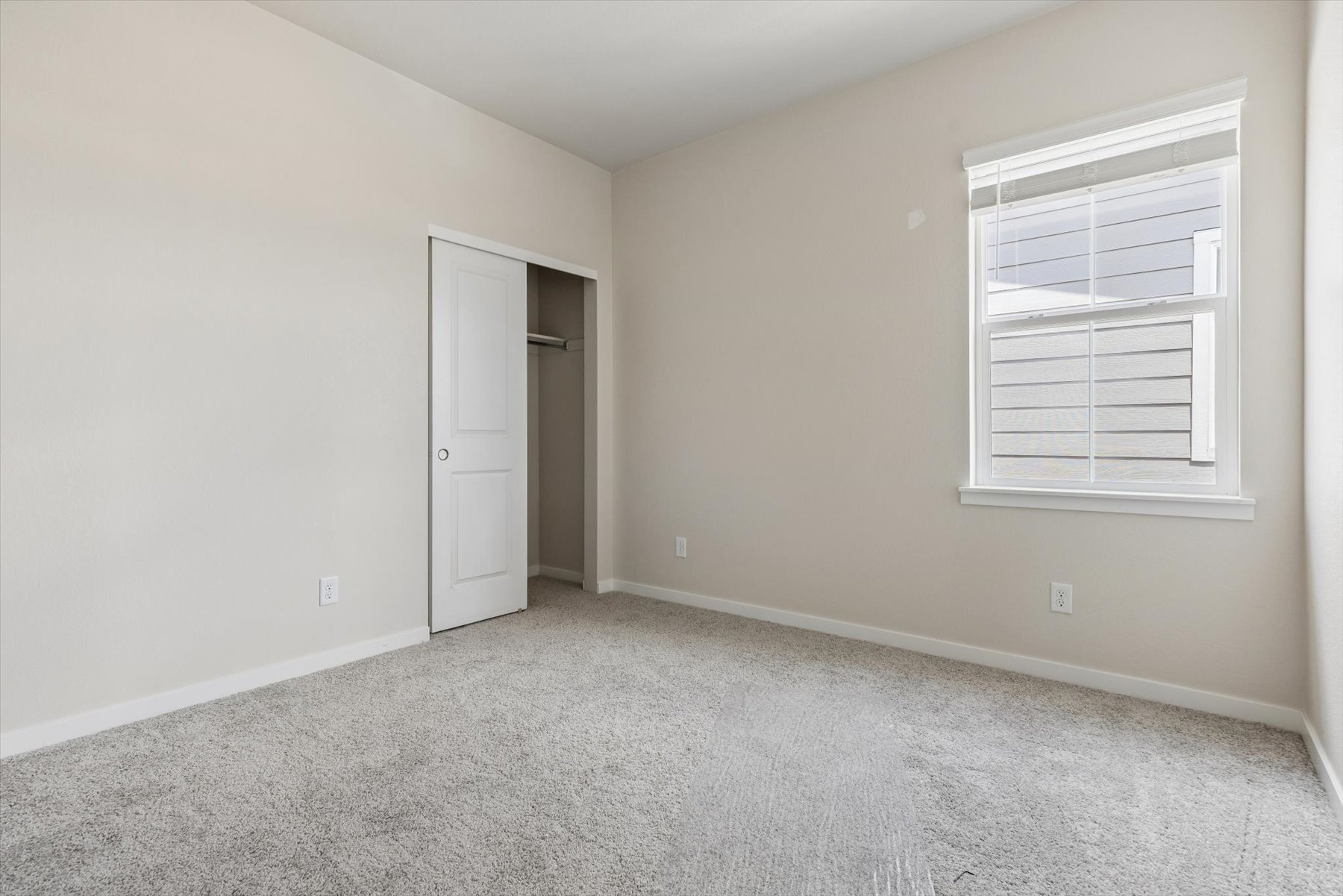 A room with a door and a window.