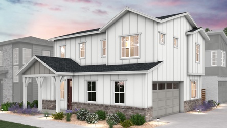 A white house with a driveway.