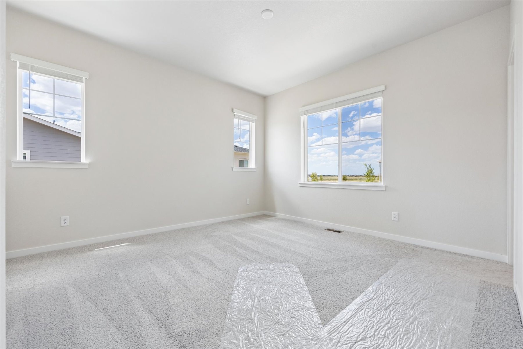 A room with a bed and a window.