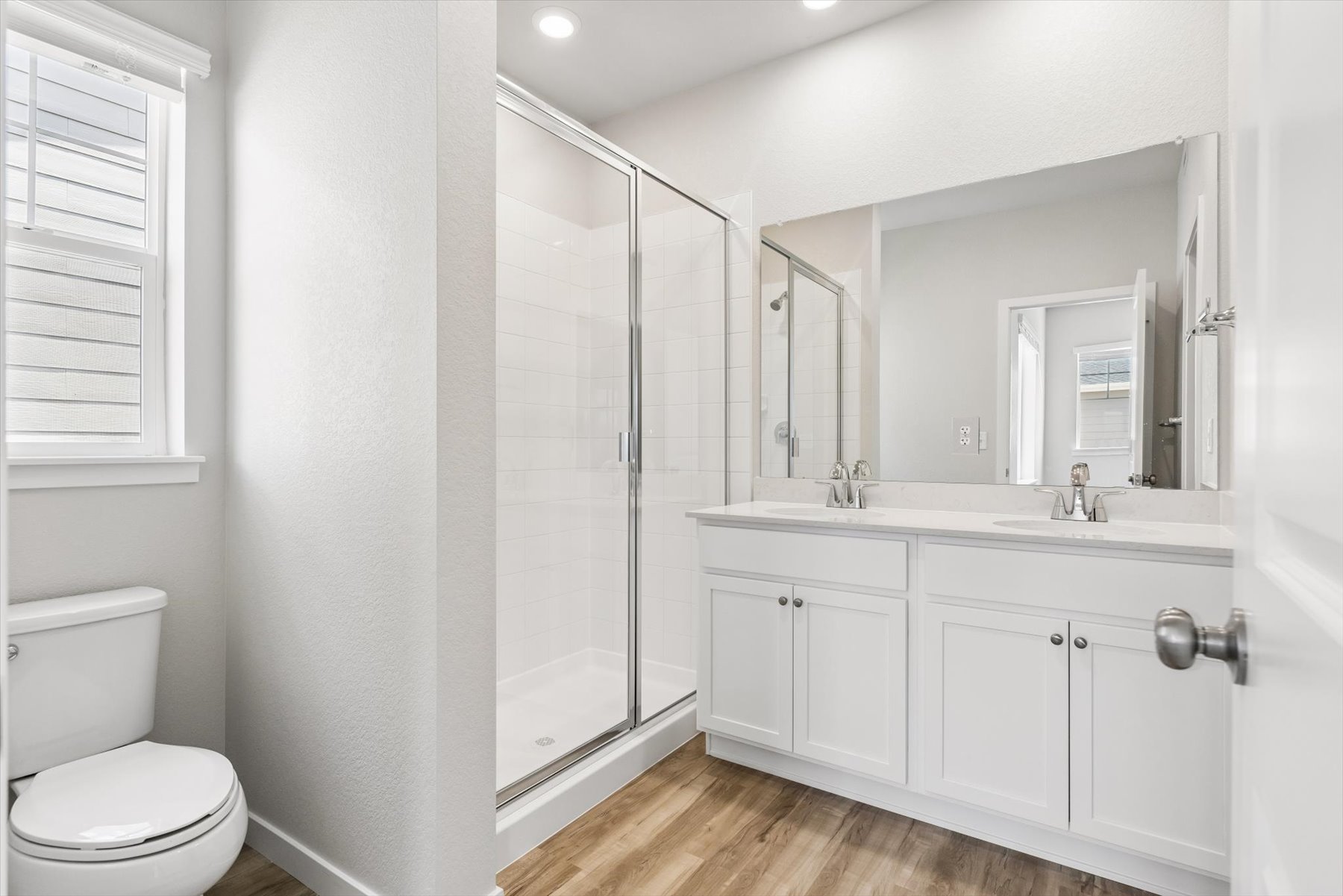 A bathroom with a glass shower.
