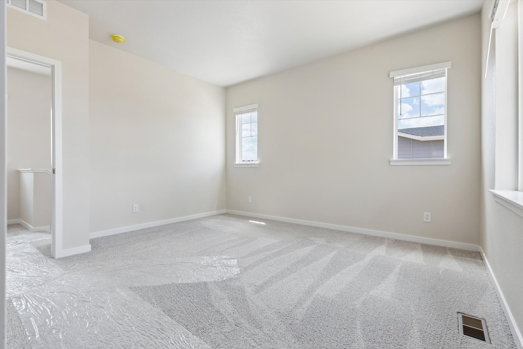 A room with a tile floor and a window.