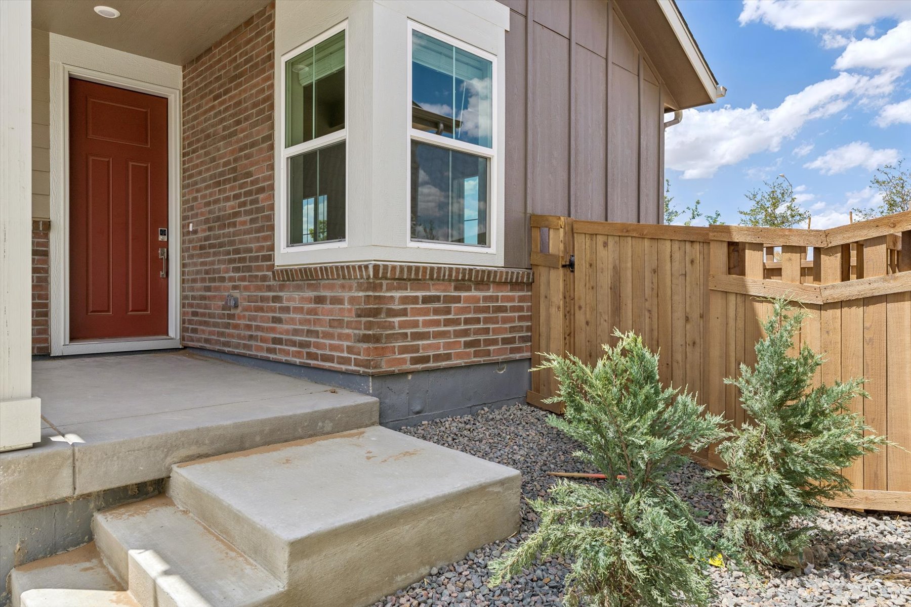A house with a fence and a door.