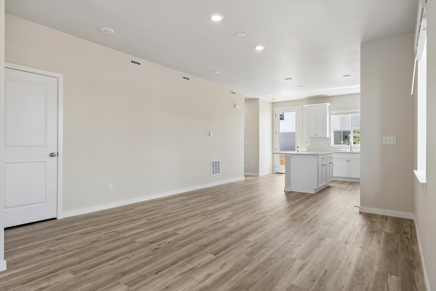 A room with white cabinets.