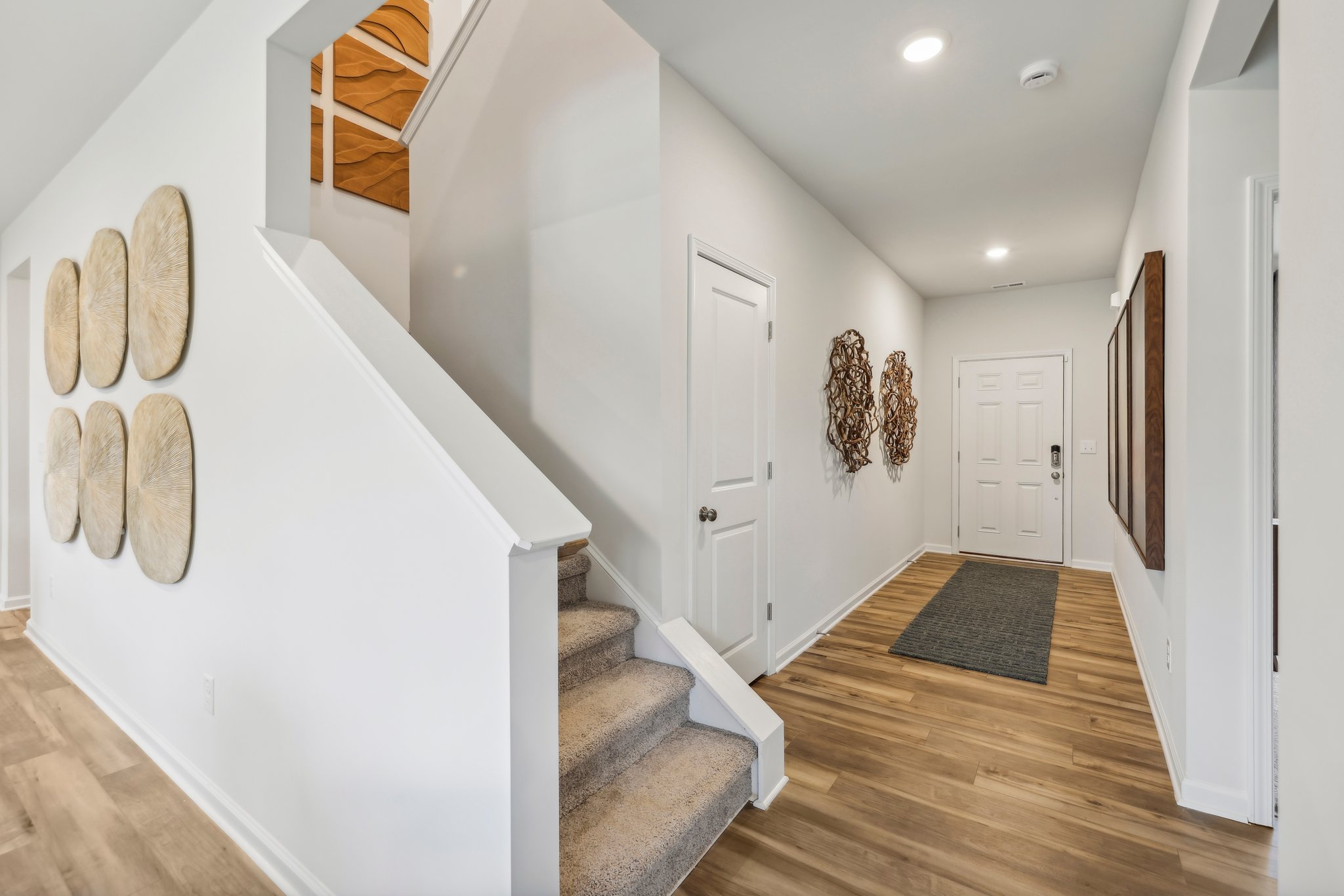 A hallway with white walls.