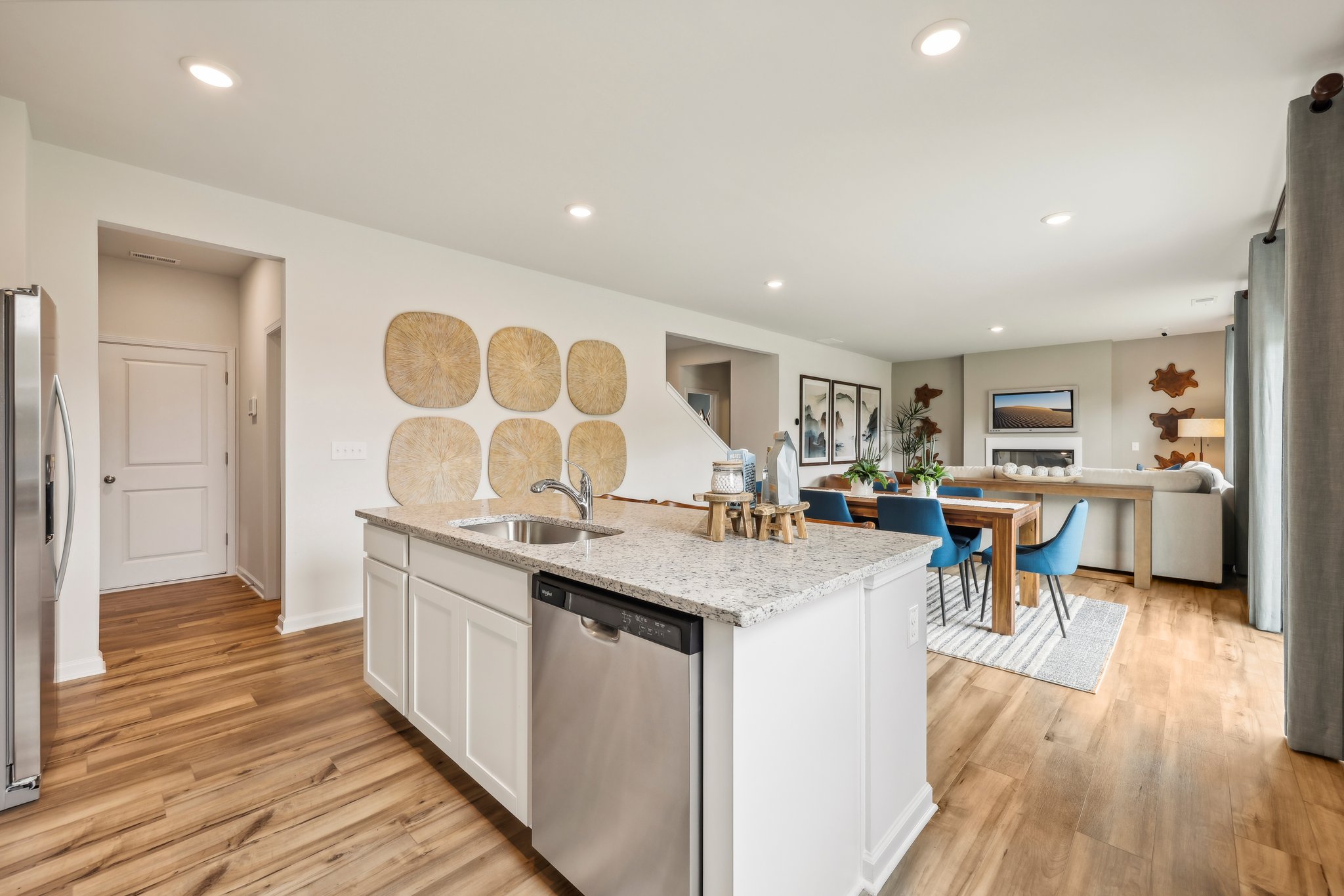 A kitchen with a wood floor.