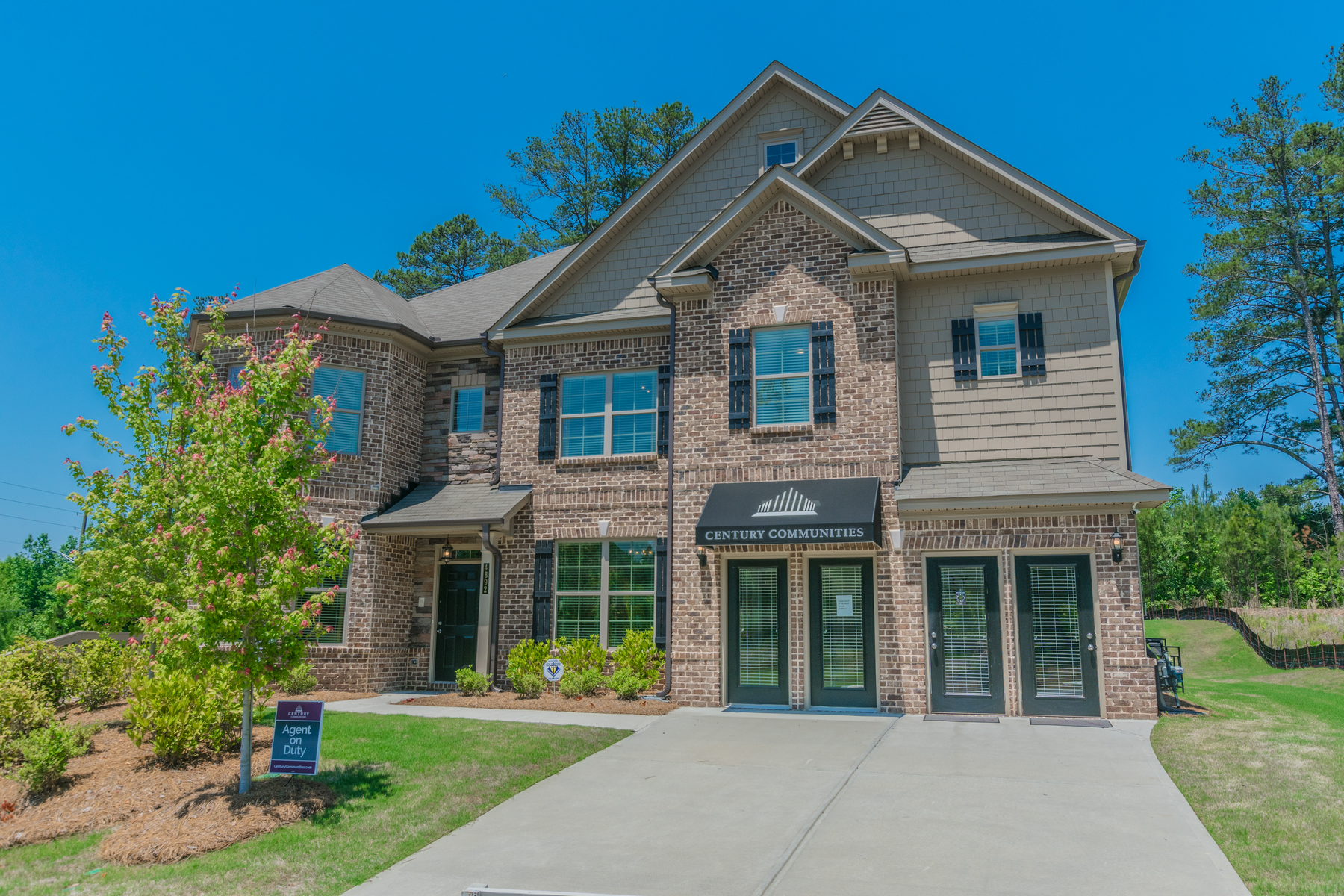 A building with a sign in front.