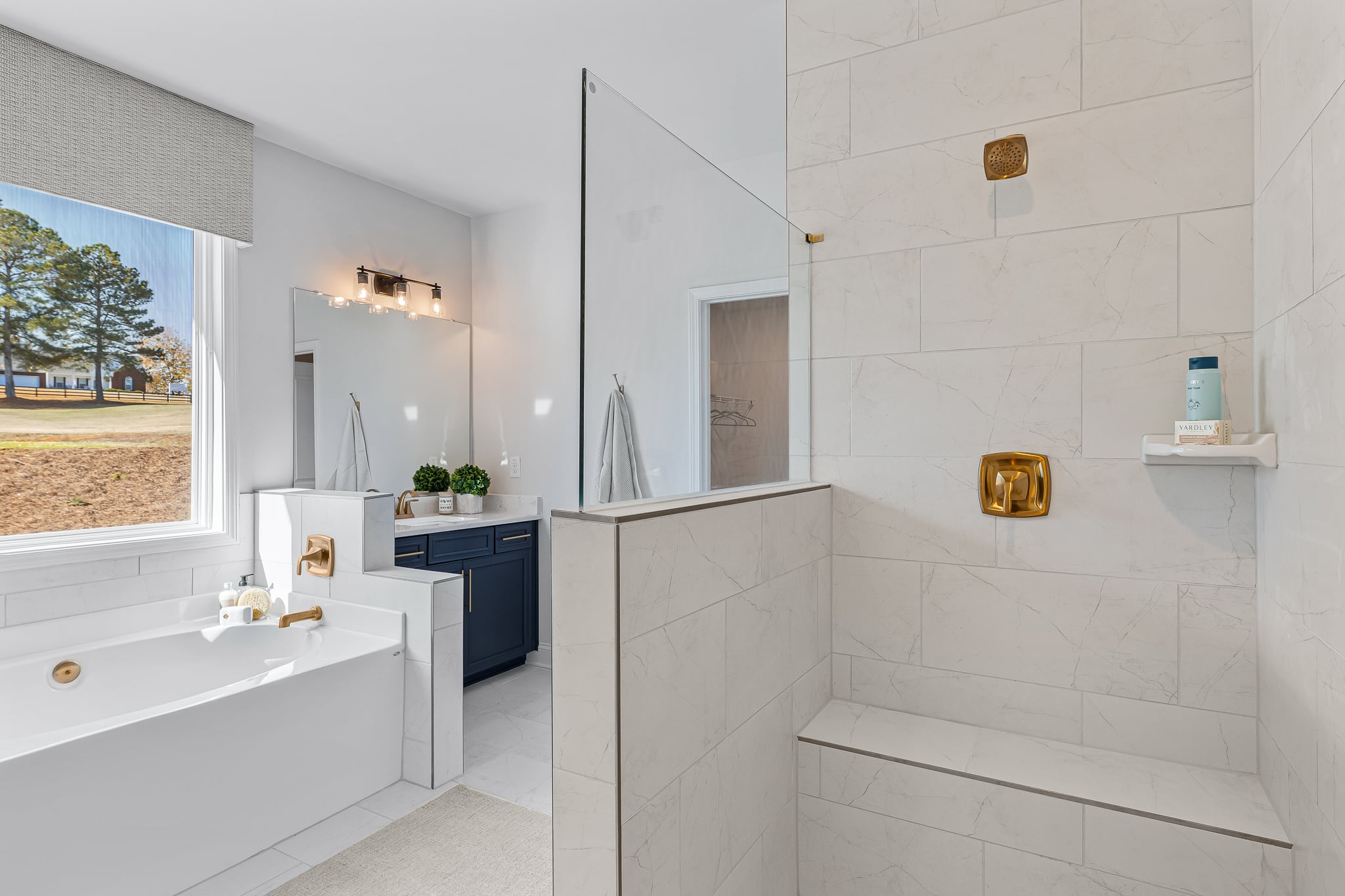A bathroom with a tub and sink.
